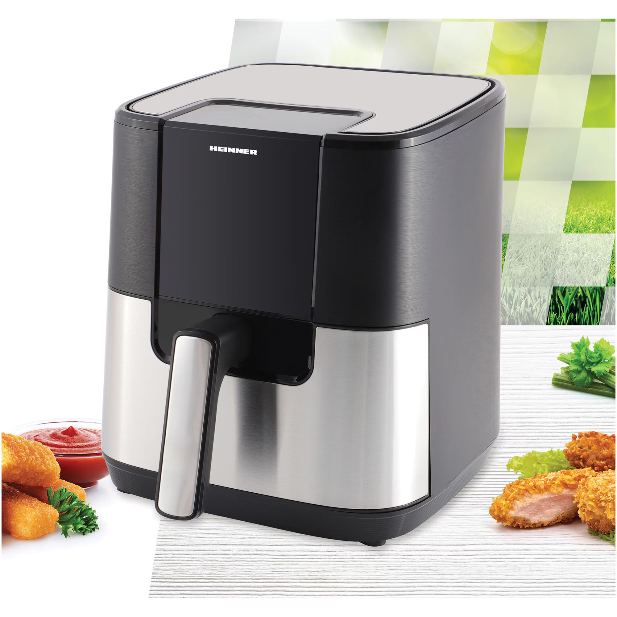 Een zwarte en zilveren airfryer met bijgerechten.