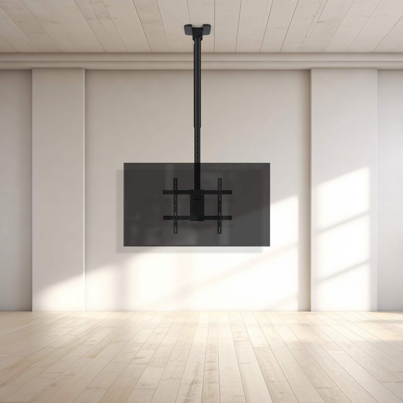 Un supporto da soffitto nero per TV è appeso a un soffitto bianco.