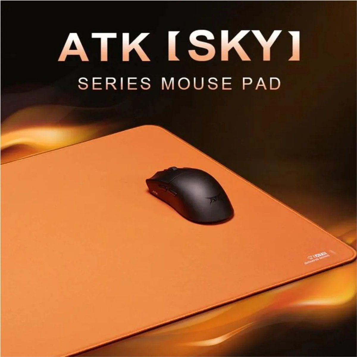 Black mouse on an orange ATK SKY series mouse pad with fiery background.