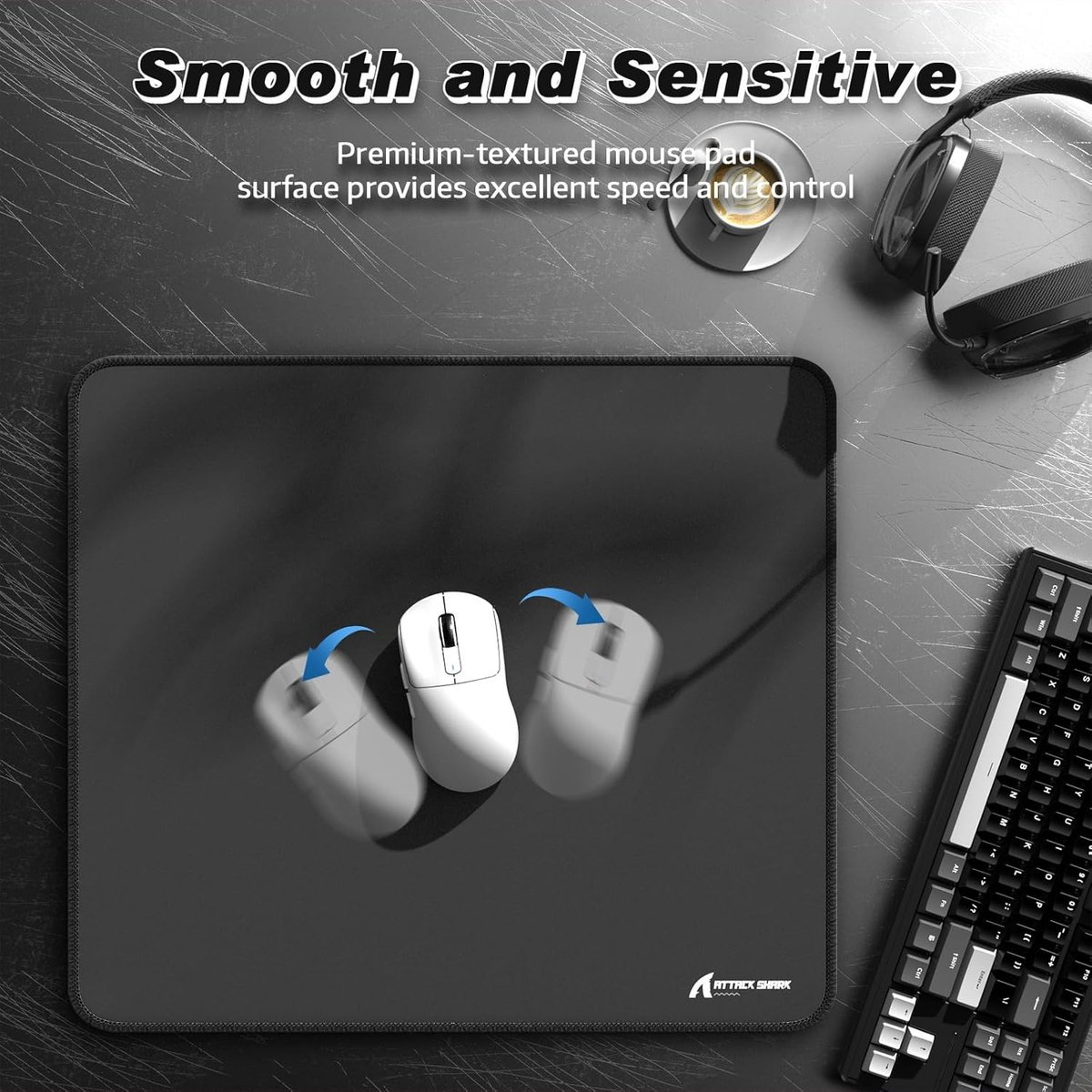 Black mousepad with white mice, keyboard, headphones, and coffee cup.