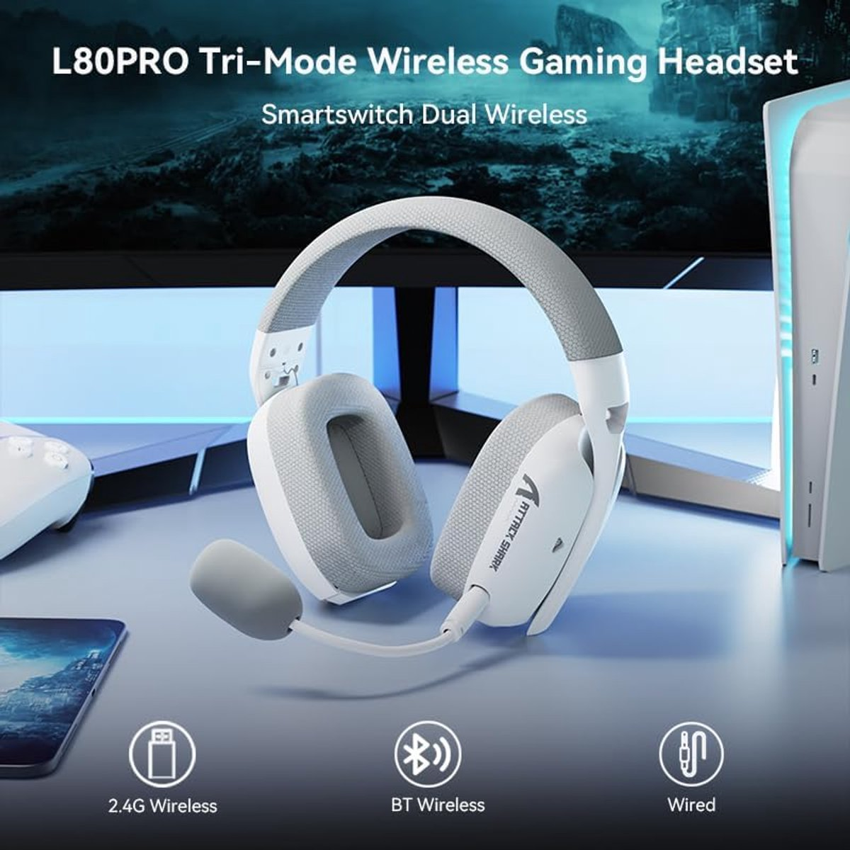 A white gaming headset with a microphone sits on a table, next to a smartphone and a controller.
