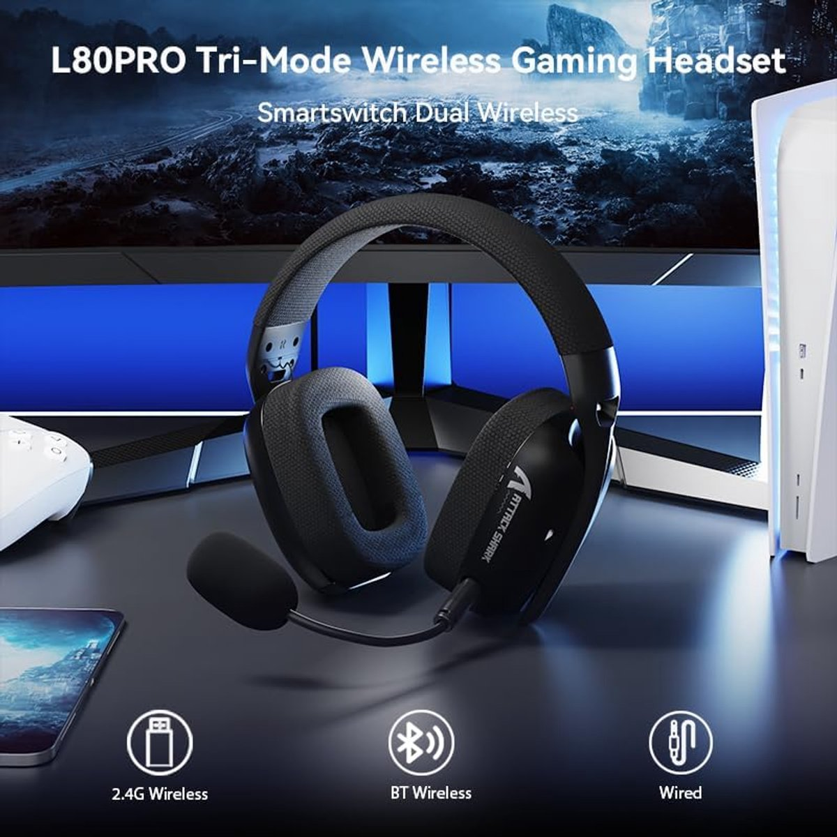 Black gaming headset with microphone, next to a controller and console.