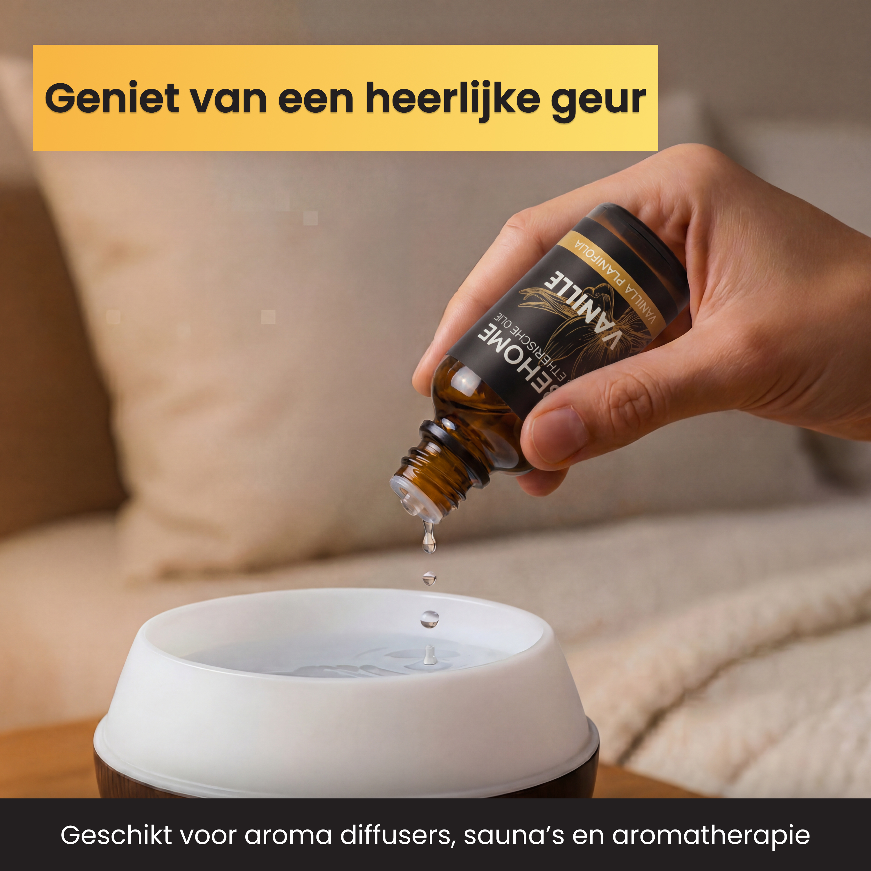 A hand drips essential vanilla oil into a diffuser.