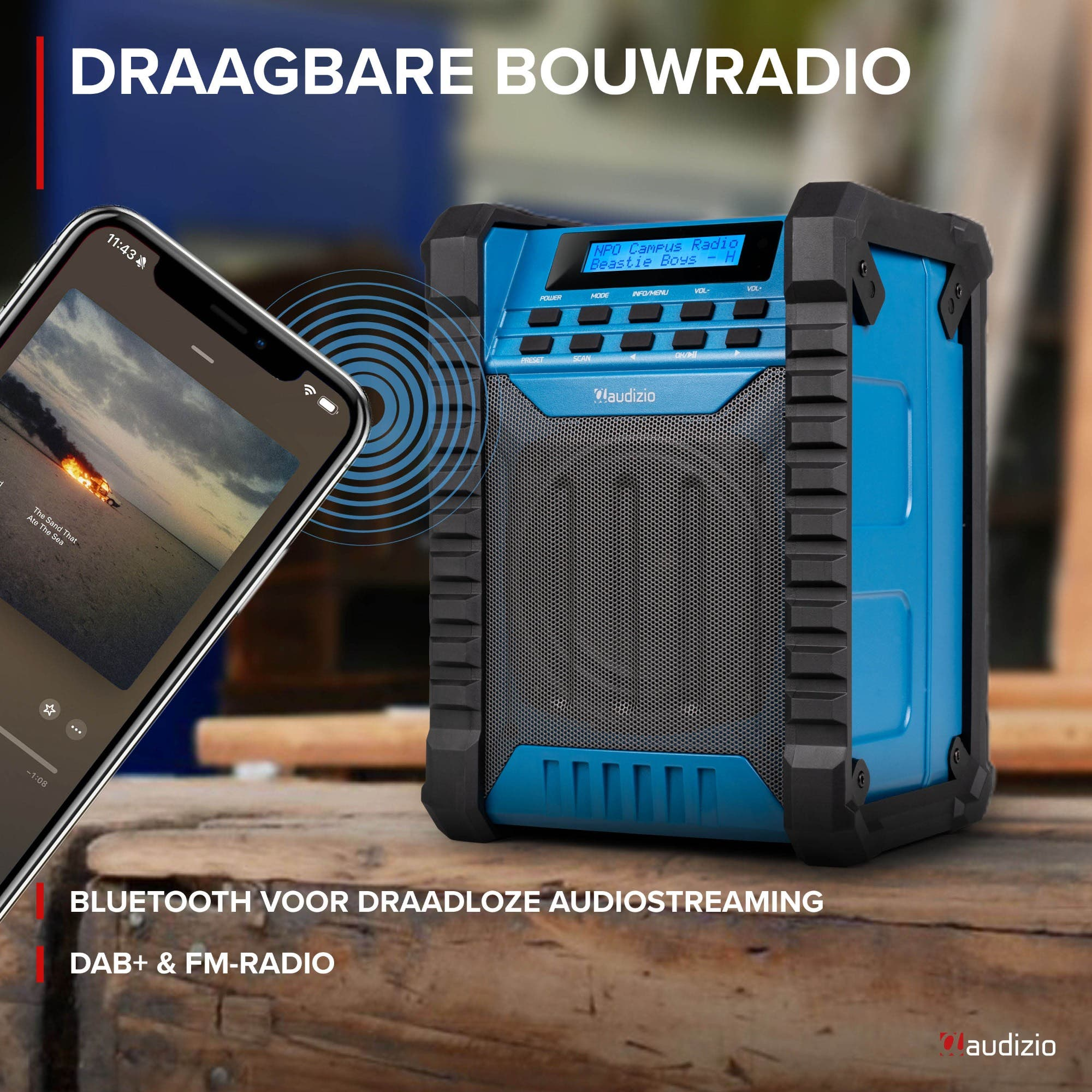 Una radio de construcción Audizio azul junto a un smartphone.