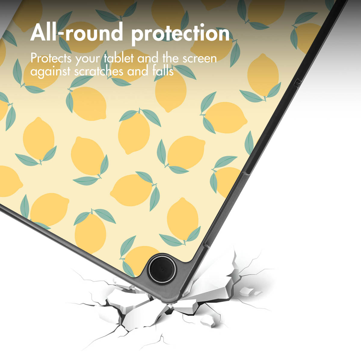 Tablet with lemon pattern falling and breaking the floor.