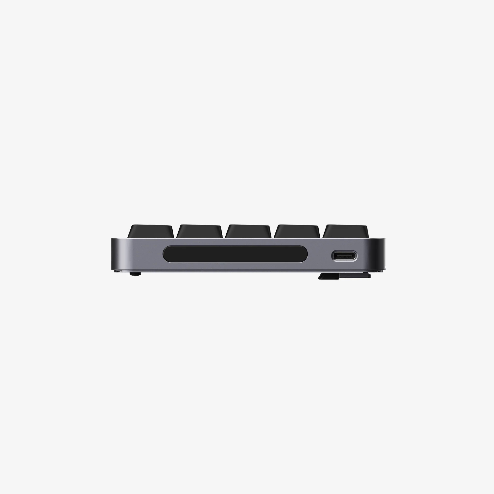 Szara klawiatura mechaniczna widok z boku z czarnymi klawiszami i portem USB-C.