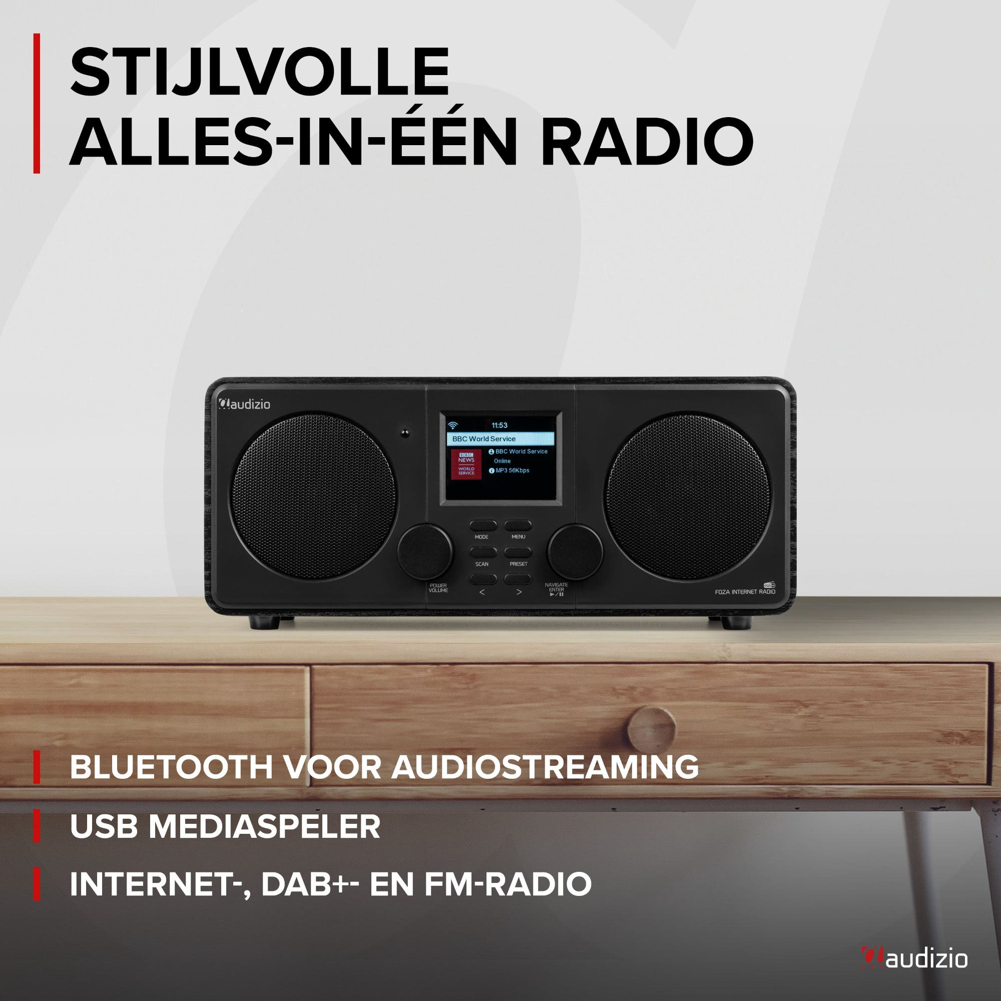 Radio internet Audizio noire avec haut-parleurs et écran sur table en bois.
