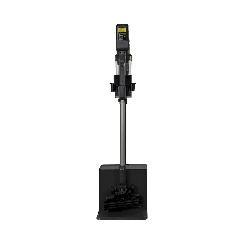 Un aspirateur sans fil avec accessoires est sur une base de chargement.