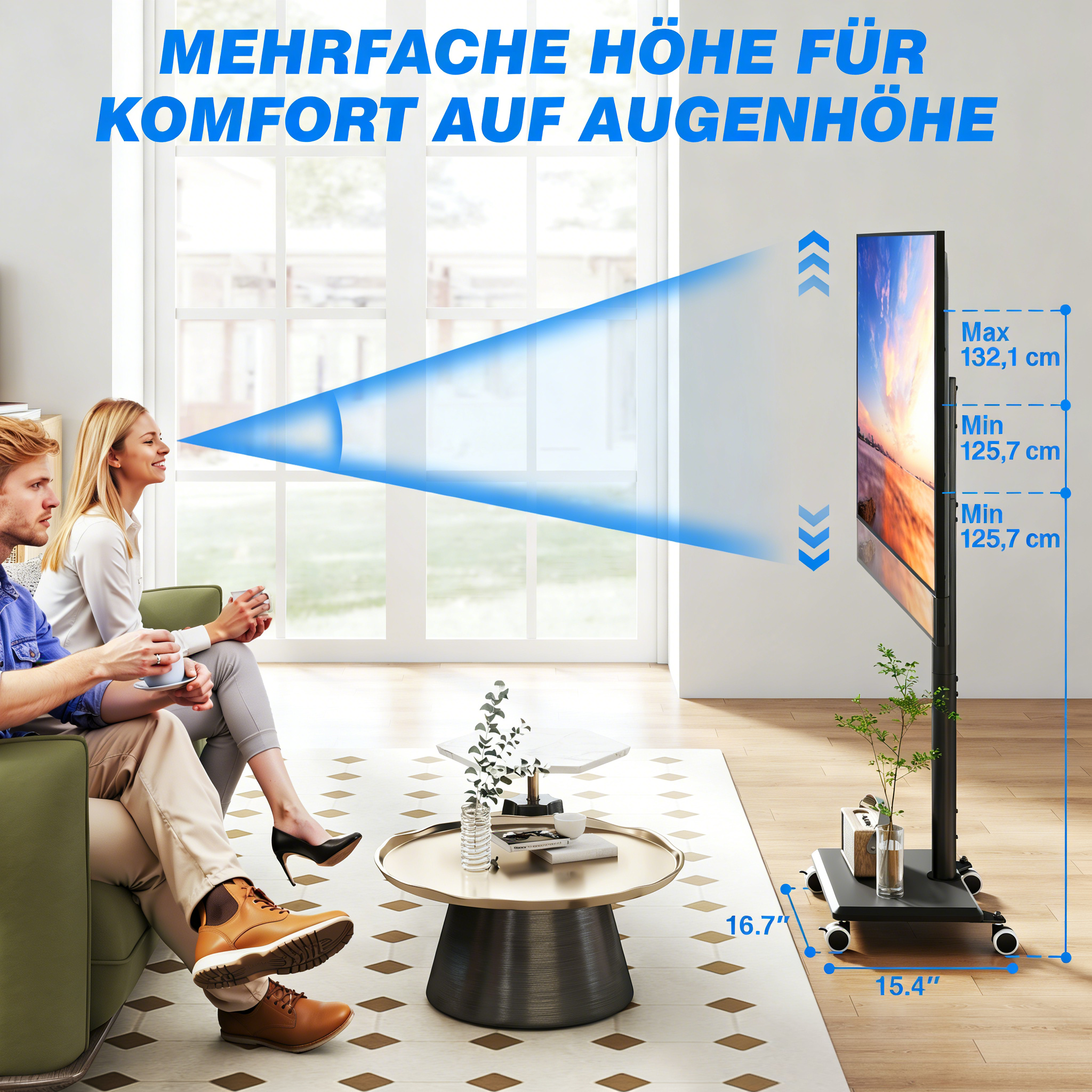 Ein Paar sitzt auf einem Sofa und schaut auf einen Fernseher auf einem Rollständer.