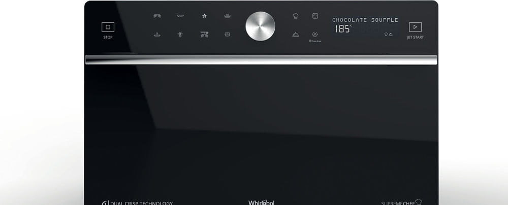 Black oven with touchscreen control panel and silver dial. Chocolate souffle set.