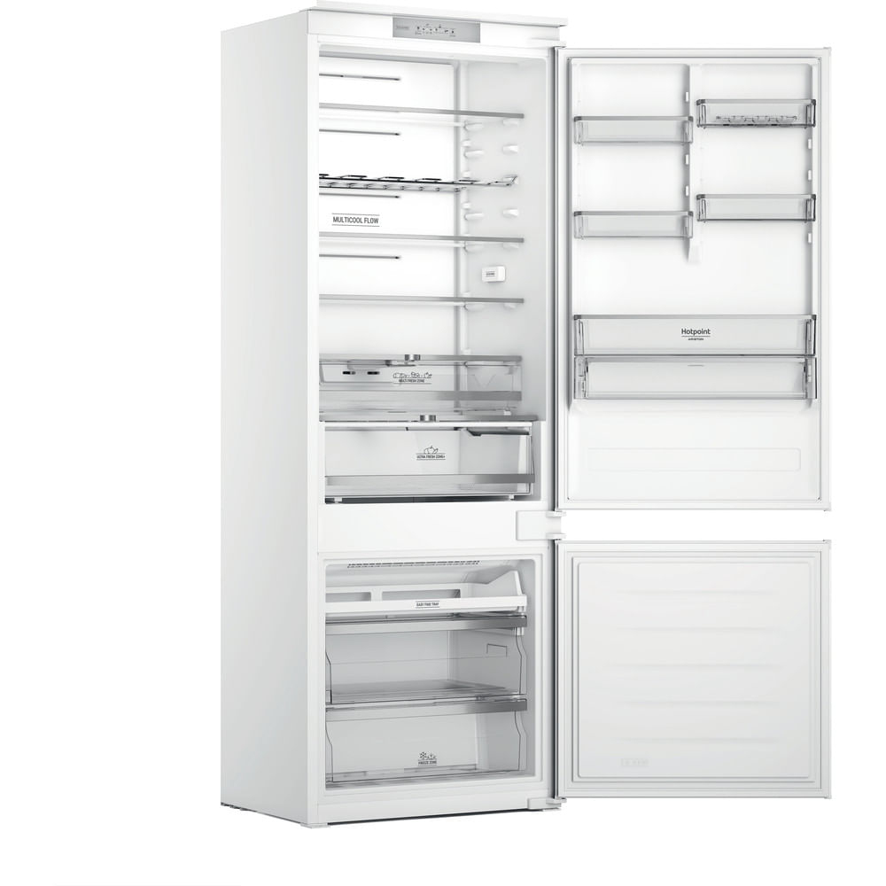 Un frigorifero bianco con la porta aperta, che mostra l'interno vuoto.