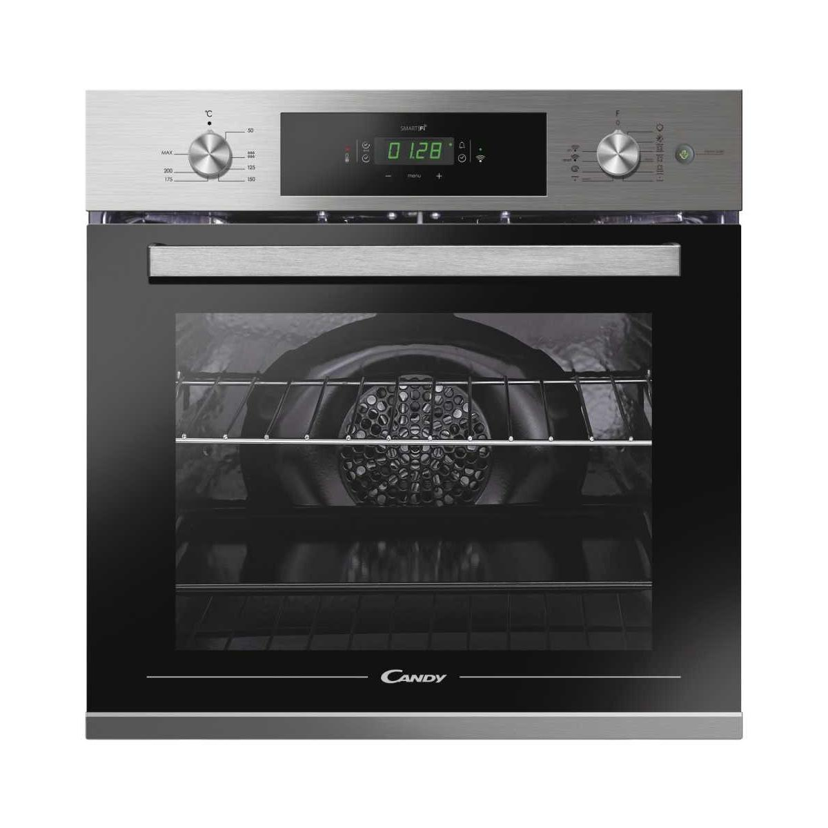 Un moderno forno Candy con display digitale, manopole e porta in vetro.