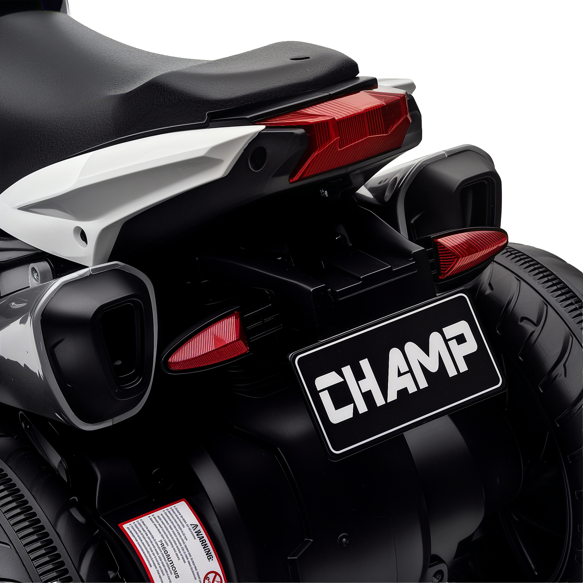 Vista posteriore moto giocattolo nera: sella, fanale posteriore, scarichi, ruote, targa 'CHAMP'.