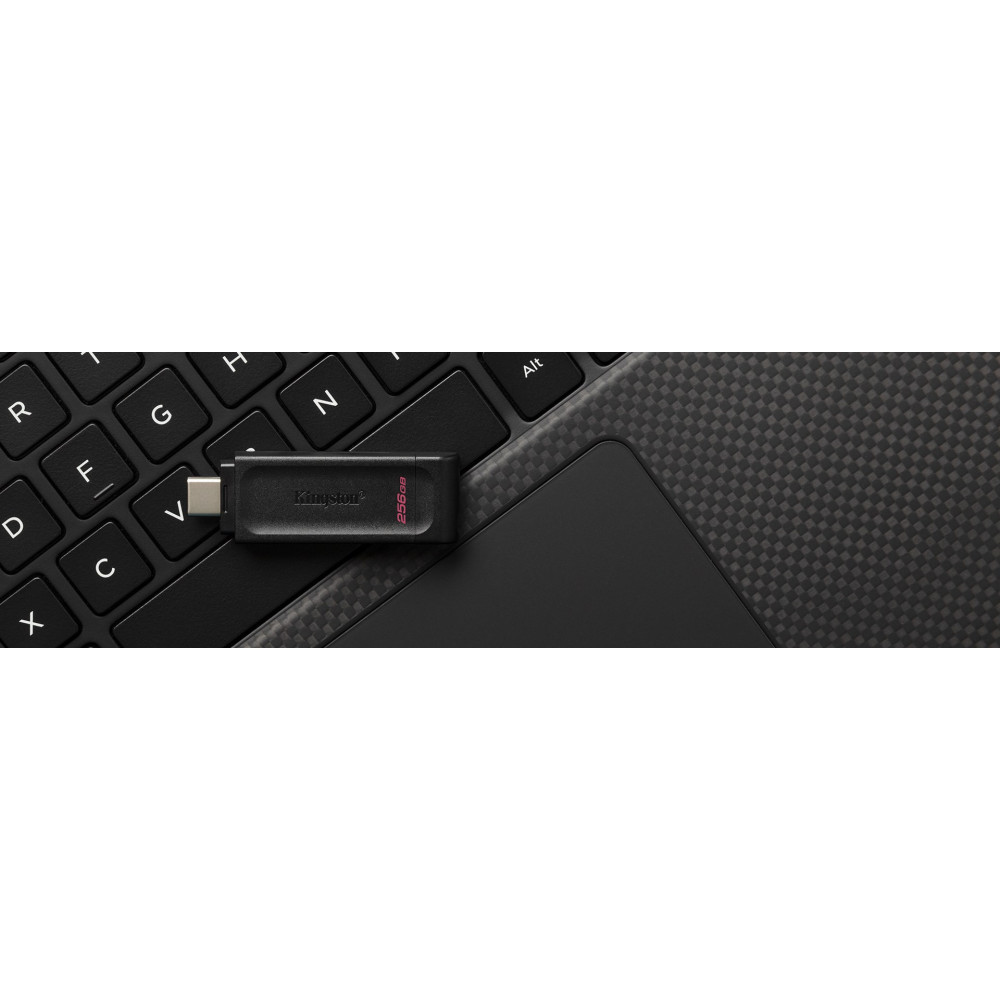 A black Kingston 256GB USB drive sits on a keyboard and trackpad.