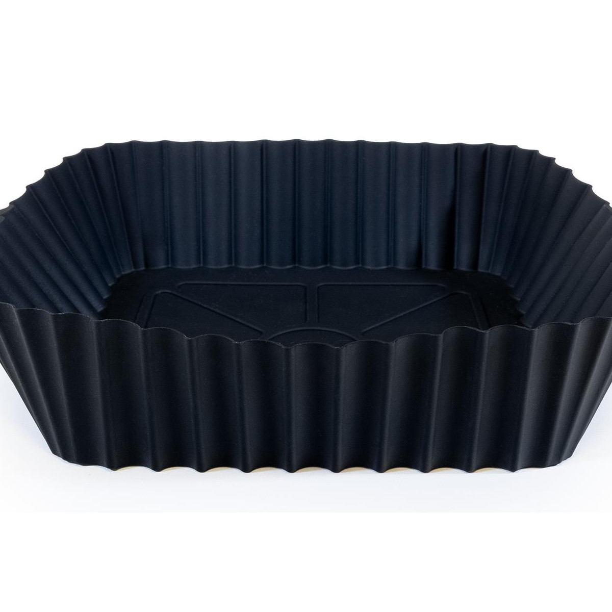 Uno stampo da forno rettangolare in silicone nero con lati scanalati.