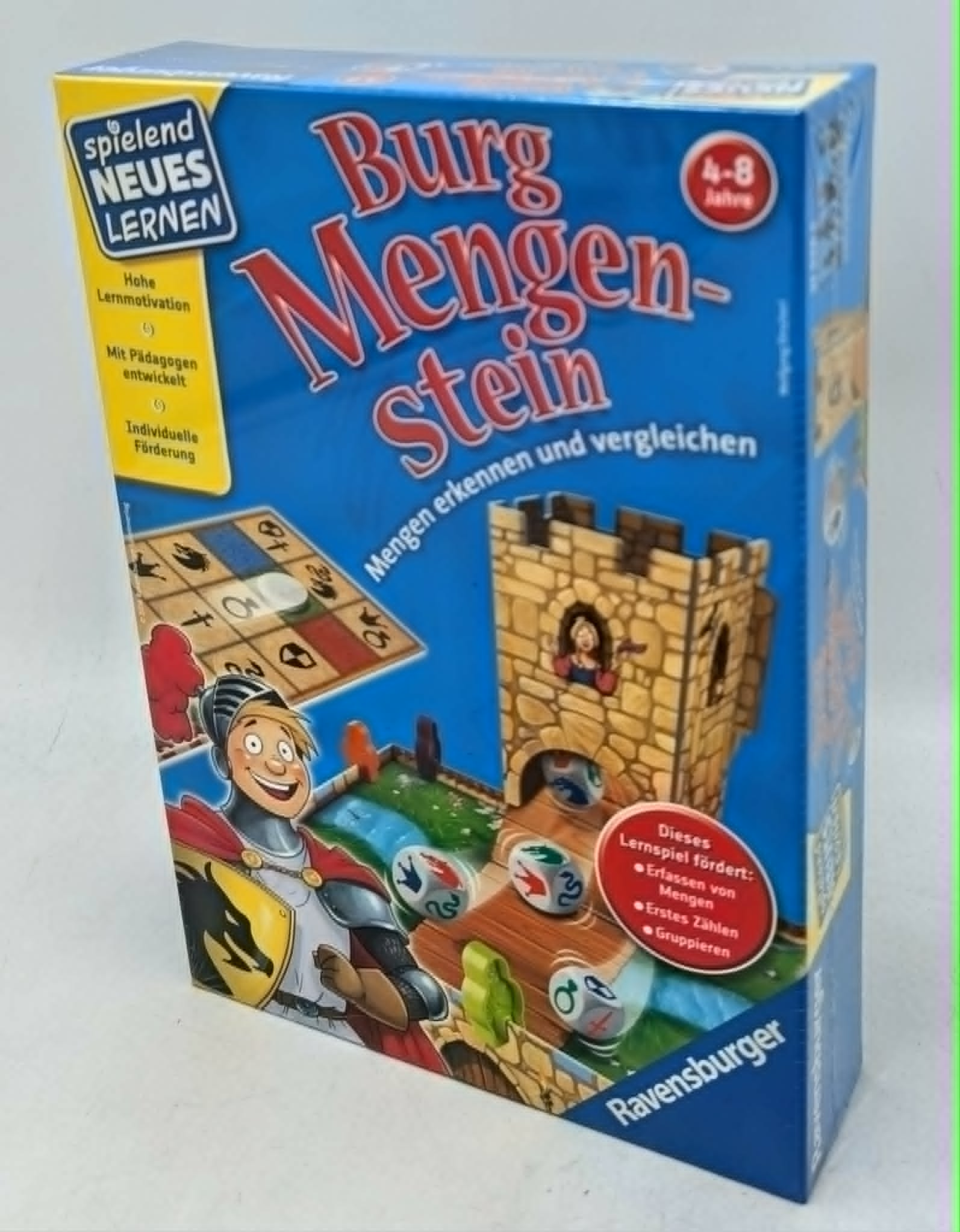 Spielschachtel 'Burg Mengen-Stein' von Ravensburger mit Ritter, Burg und Würfeln.