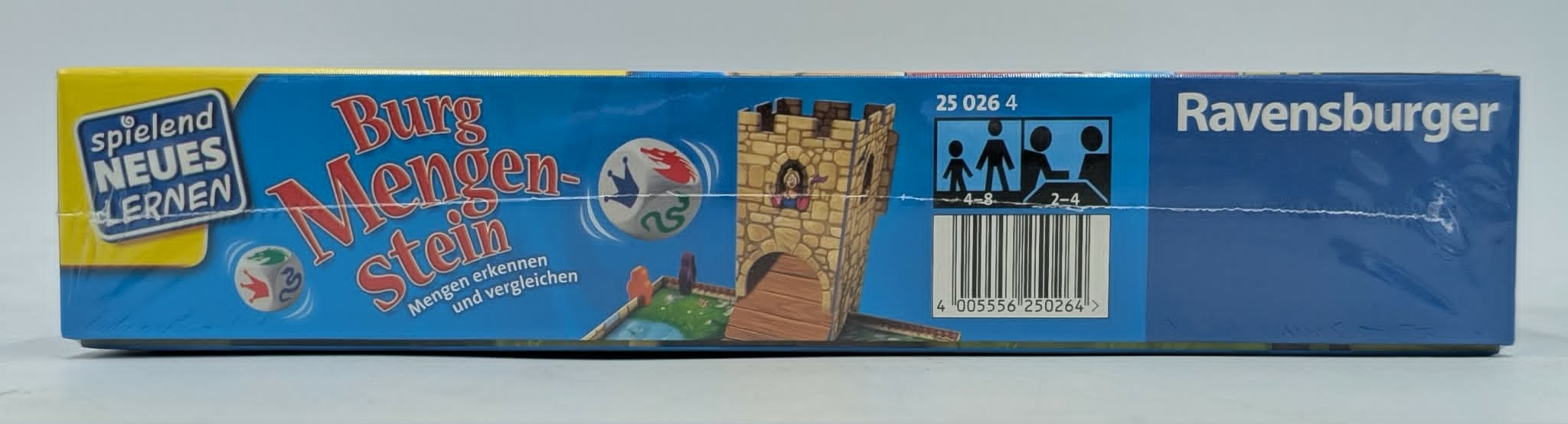Spieleschachtel mit Burg, Würfel und Spielern. Ravensburger Logo.