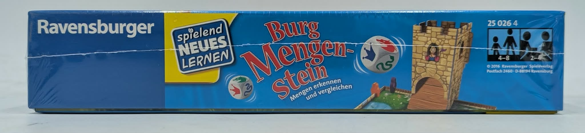 Ravensburger Spiel "Burg Mengen-Stein" mit Würfeln, Burg und Spielern-Symbolen.