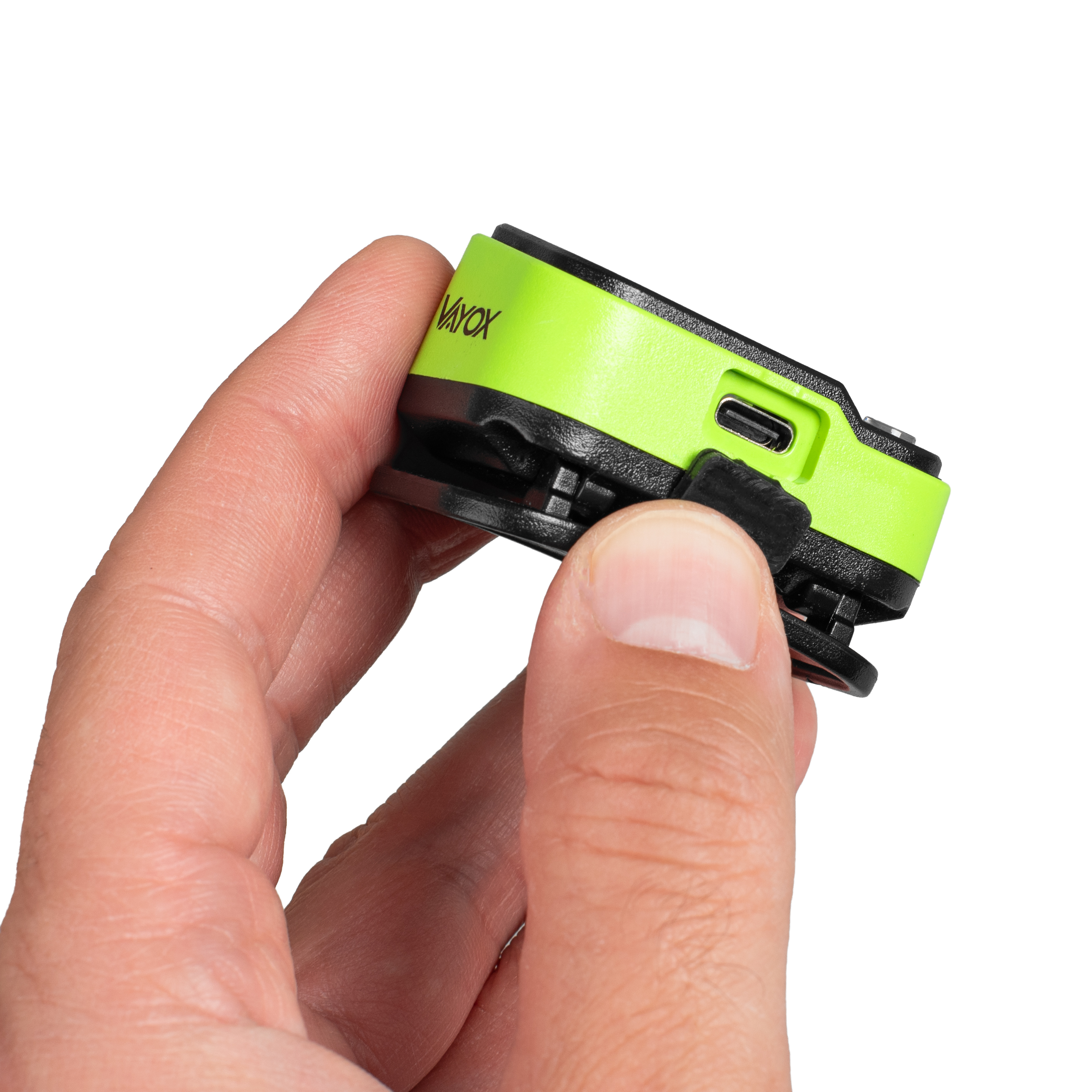 Dłoń trzyma neonowo zielone urządzenie z czarnym klipsem i portem USB-C.