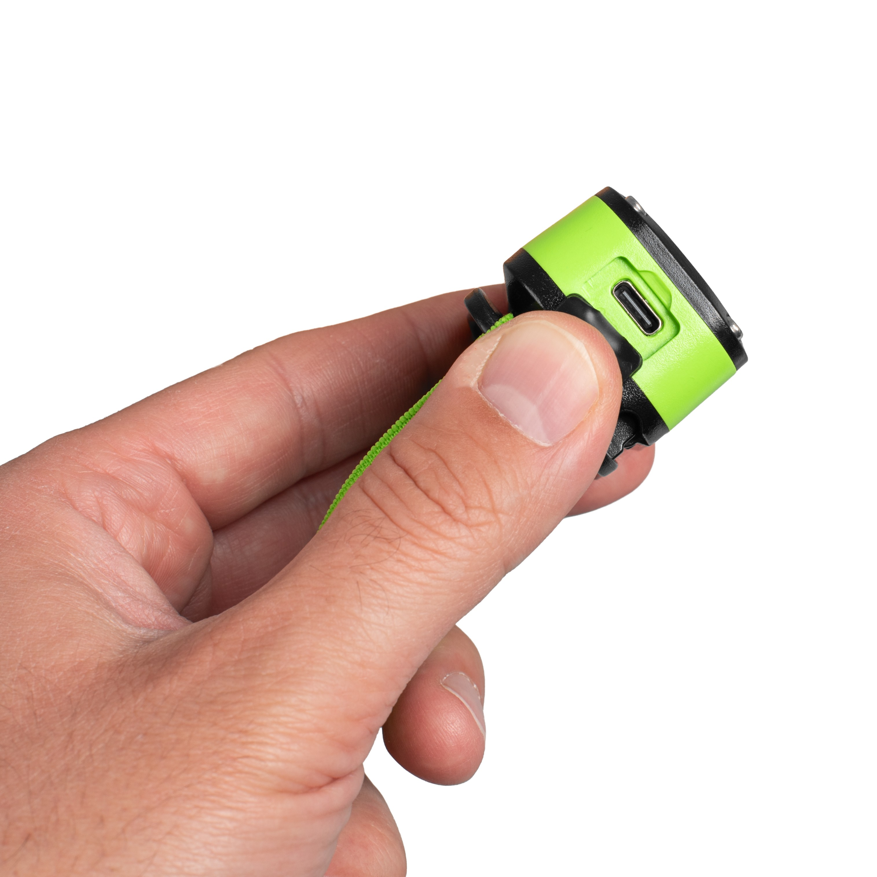 Dłoń trzyma małe, zielono-czarne urządzenie z portem USB-C.
