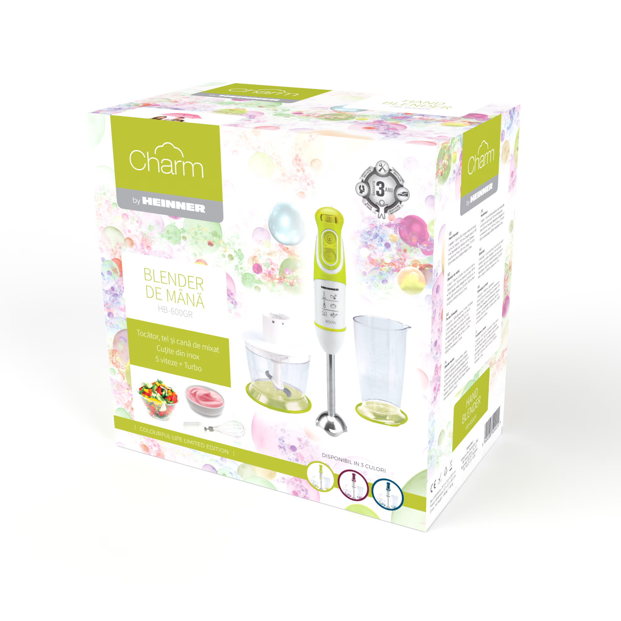 Verpackung eines grünen Stabmixers mit Zubehör und Obstsalat.