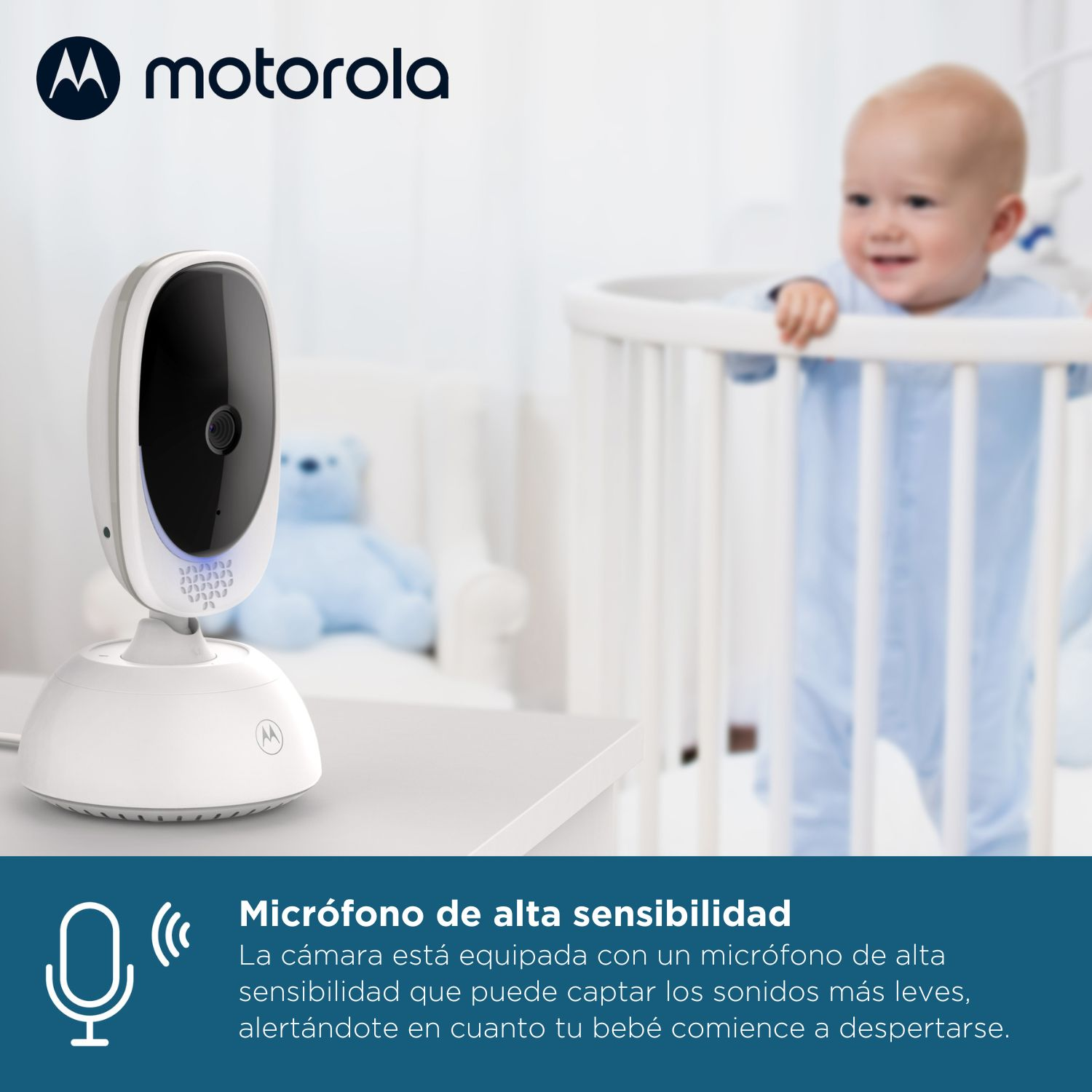 Telecamera baby monitor Motorola con bambino sorridente nella culla. Microfono sensibile.