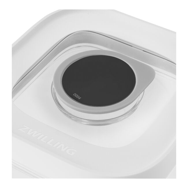 Primer plano de la tapa blanca de un contenedor de alimentos Zwilling con dial gris y pantalla negra.