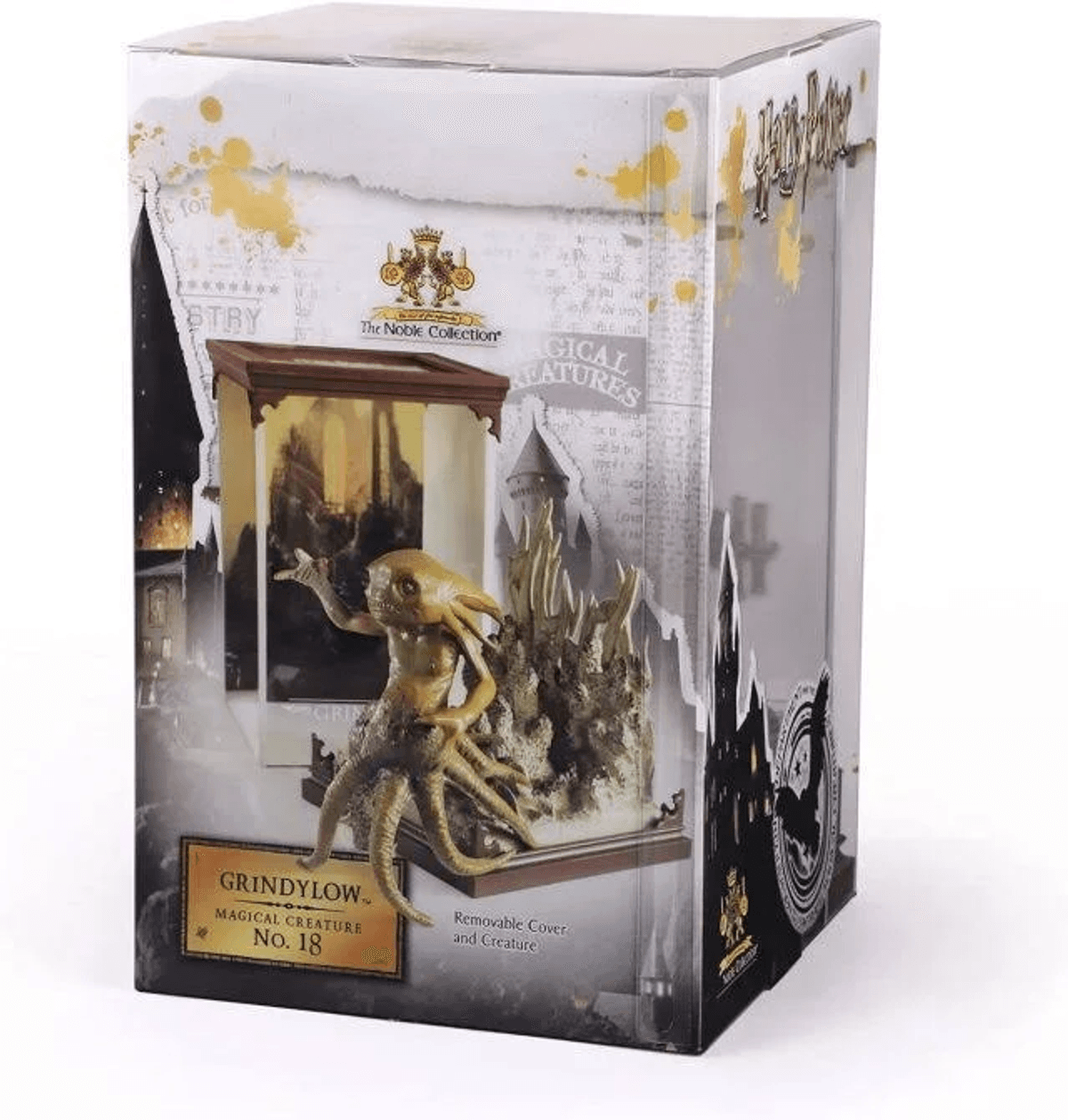 Figura de Grindelwald de Harry Potter en caja con criatura dorada y base. Noble Collection.