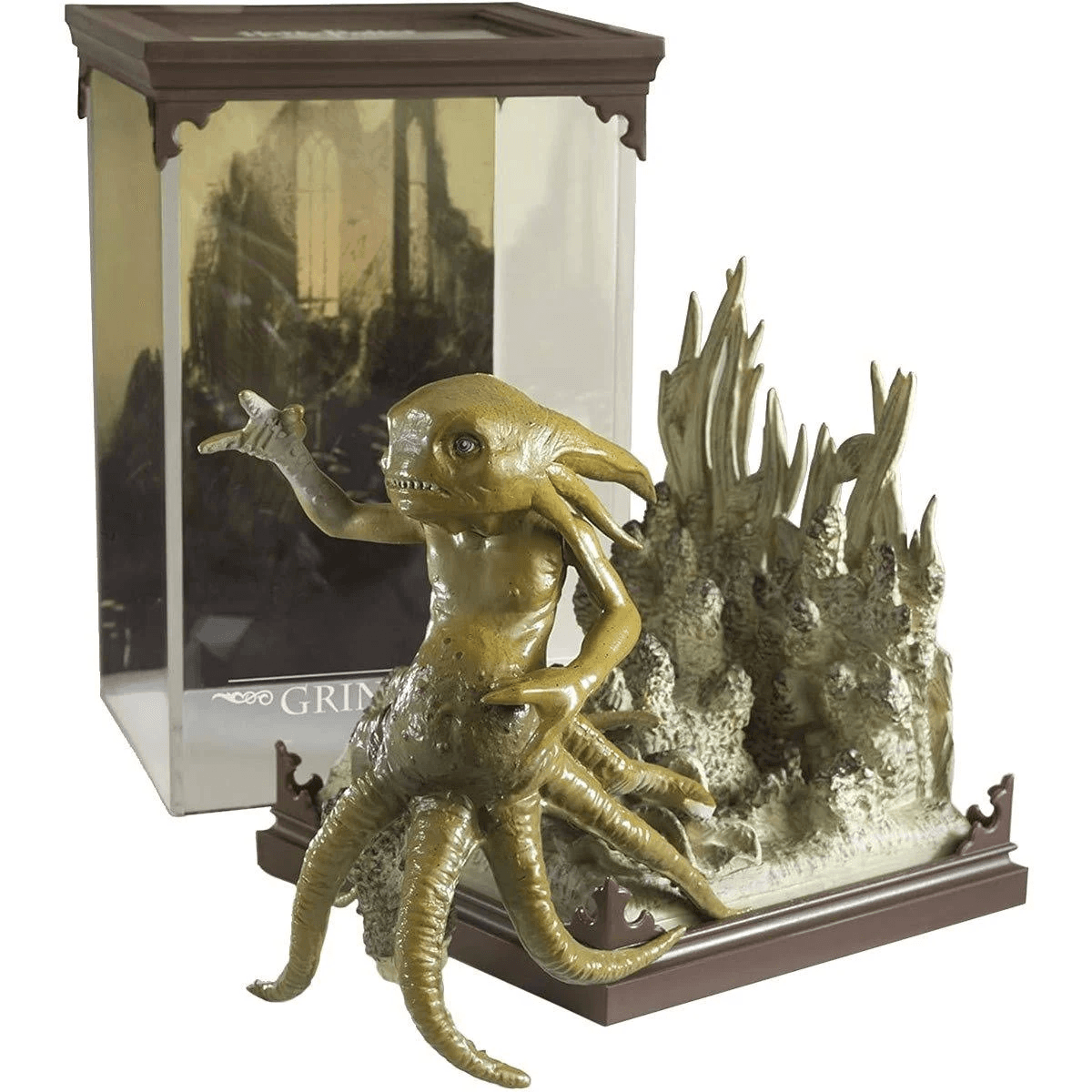 Una figura de color marrón dorado de una criatura con tentáculos y cabeza de pez, sobre base.