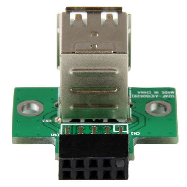 Un PCB verde con un connettore USB e un connettore maschio nero da 9 pin.