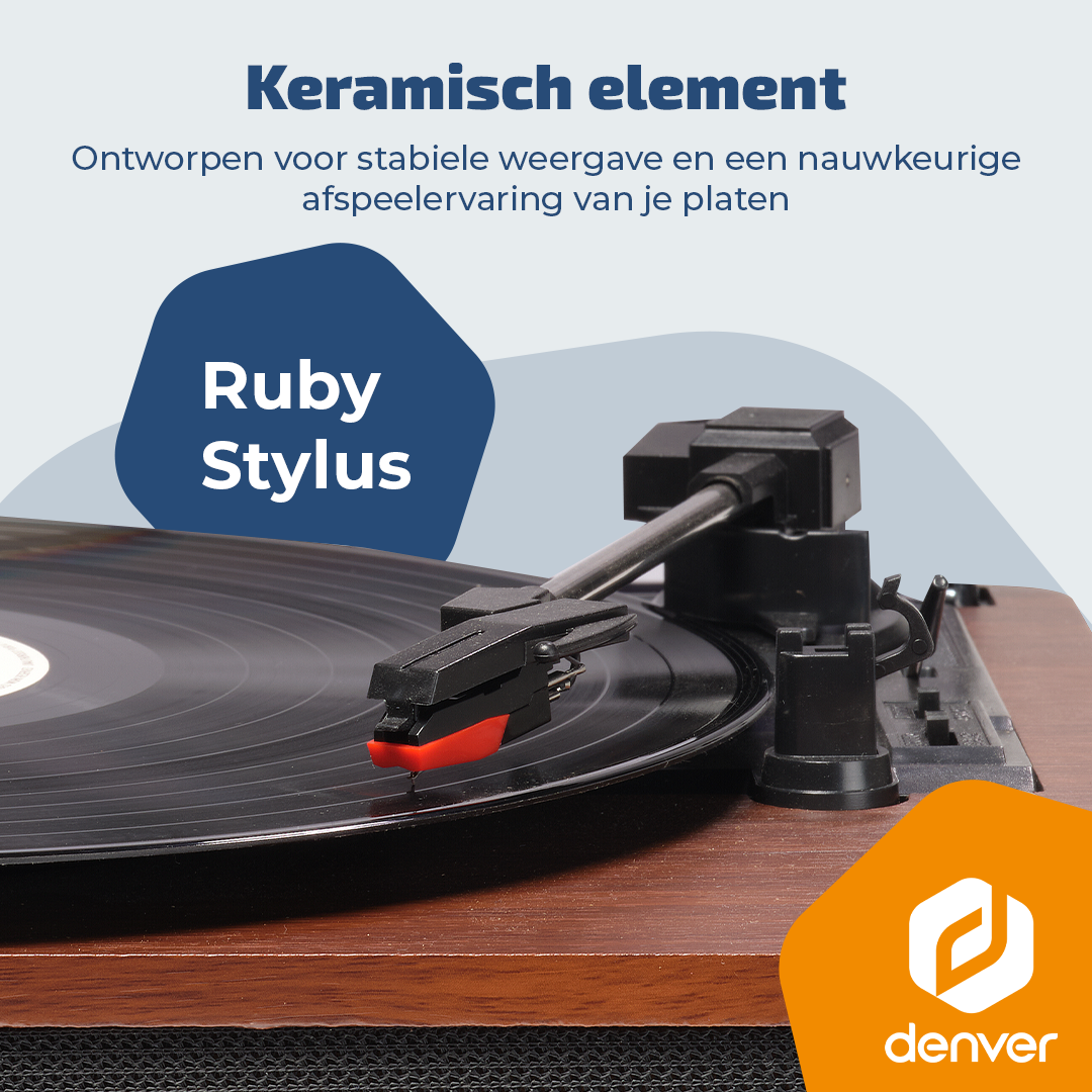 Une platine vinyle avec un saphir rouge et noir sur un disque noir.