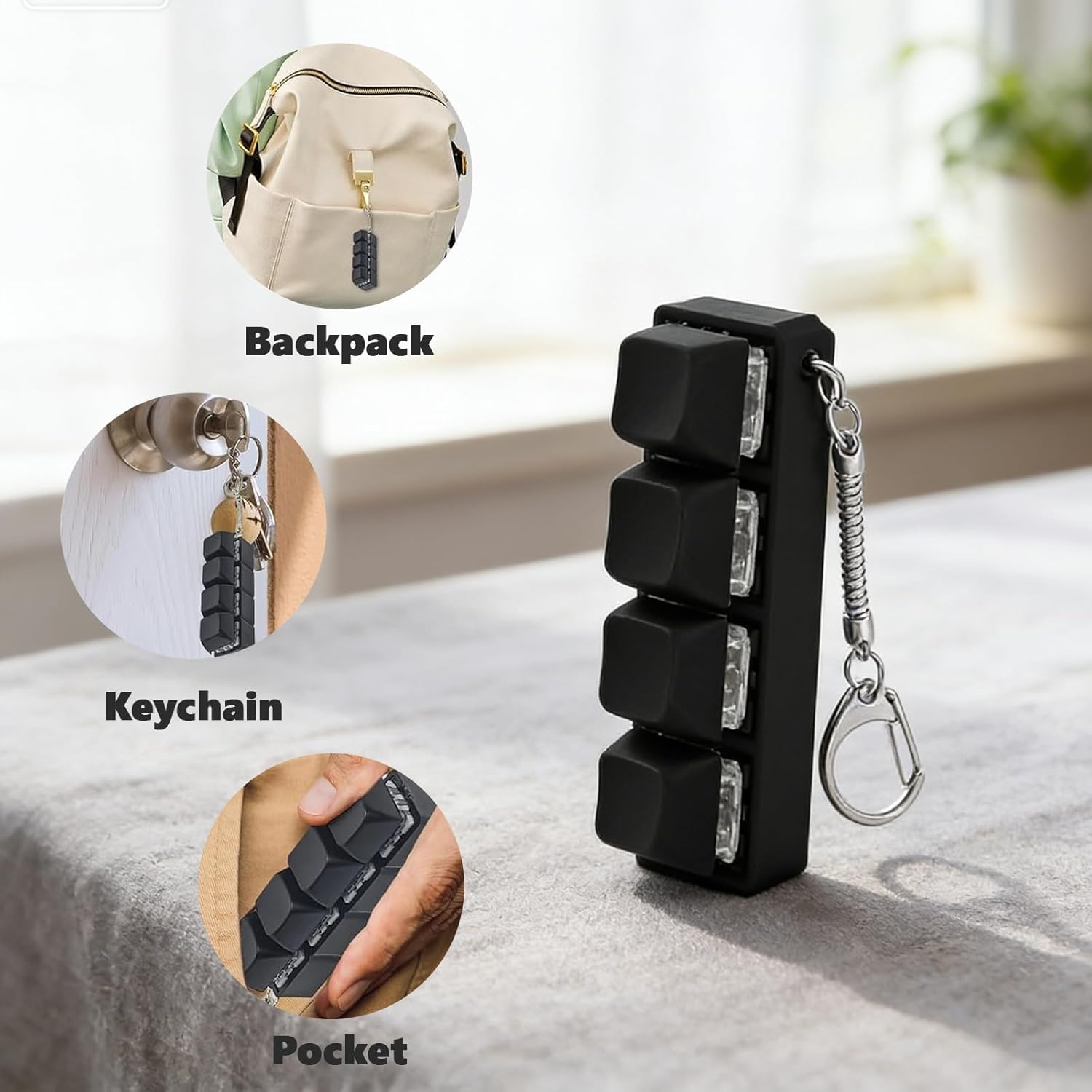 Schwarzer Schlüsselanhänger mit vier Tastenkappen, der an einem Rucksack befestigt ist.