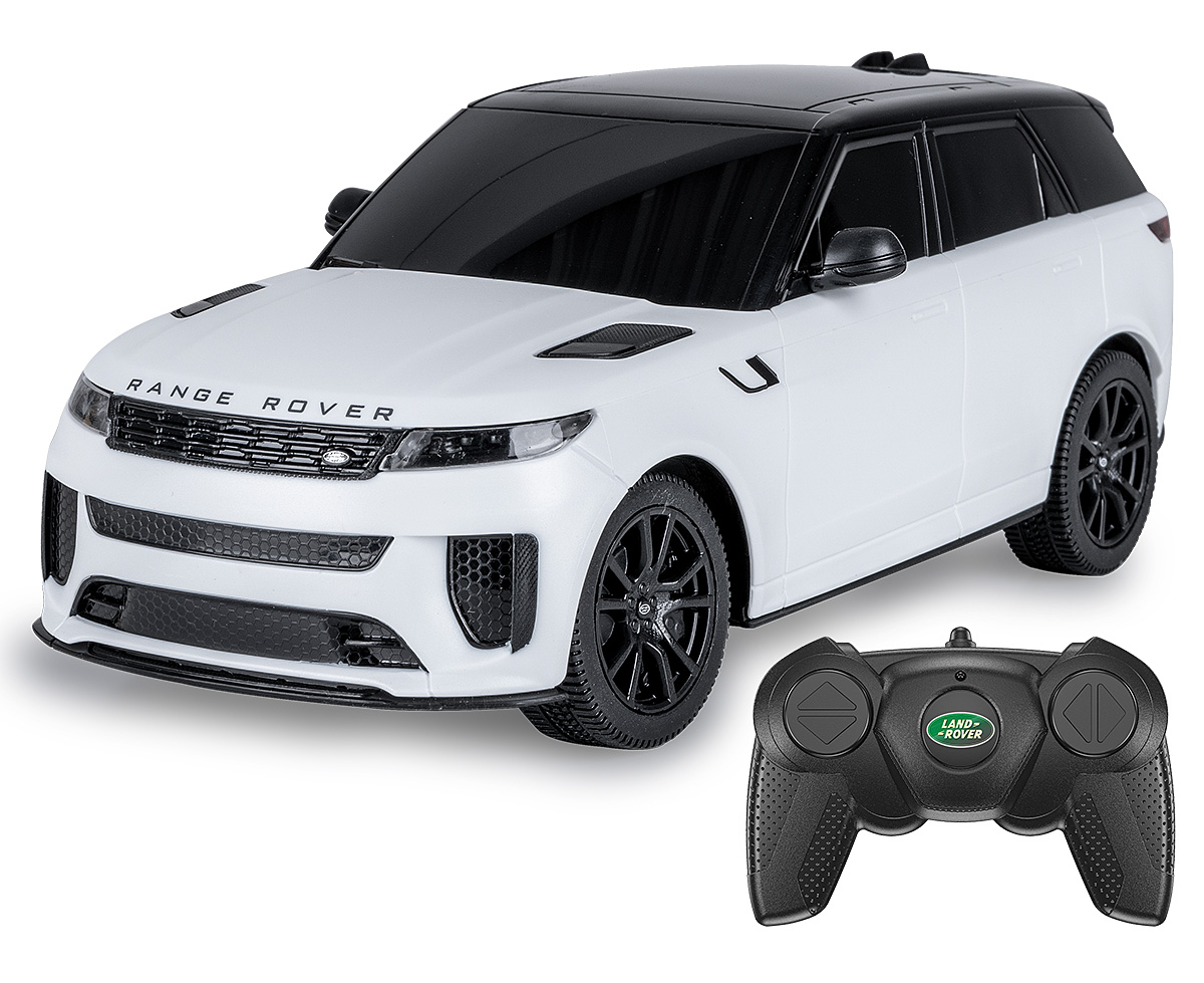 Ein weißer Range Rover Spielzeugwagen mit schwarzem Dach und Felgen, neben seiner schwarzen Fernbedienung.