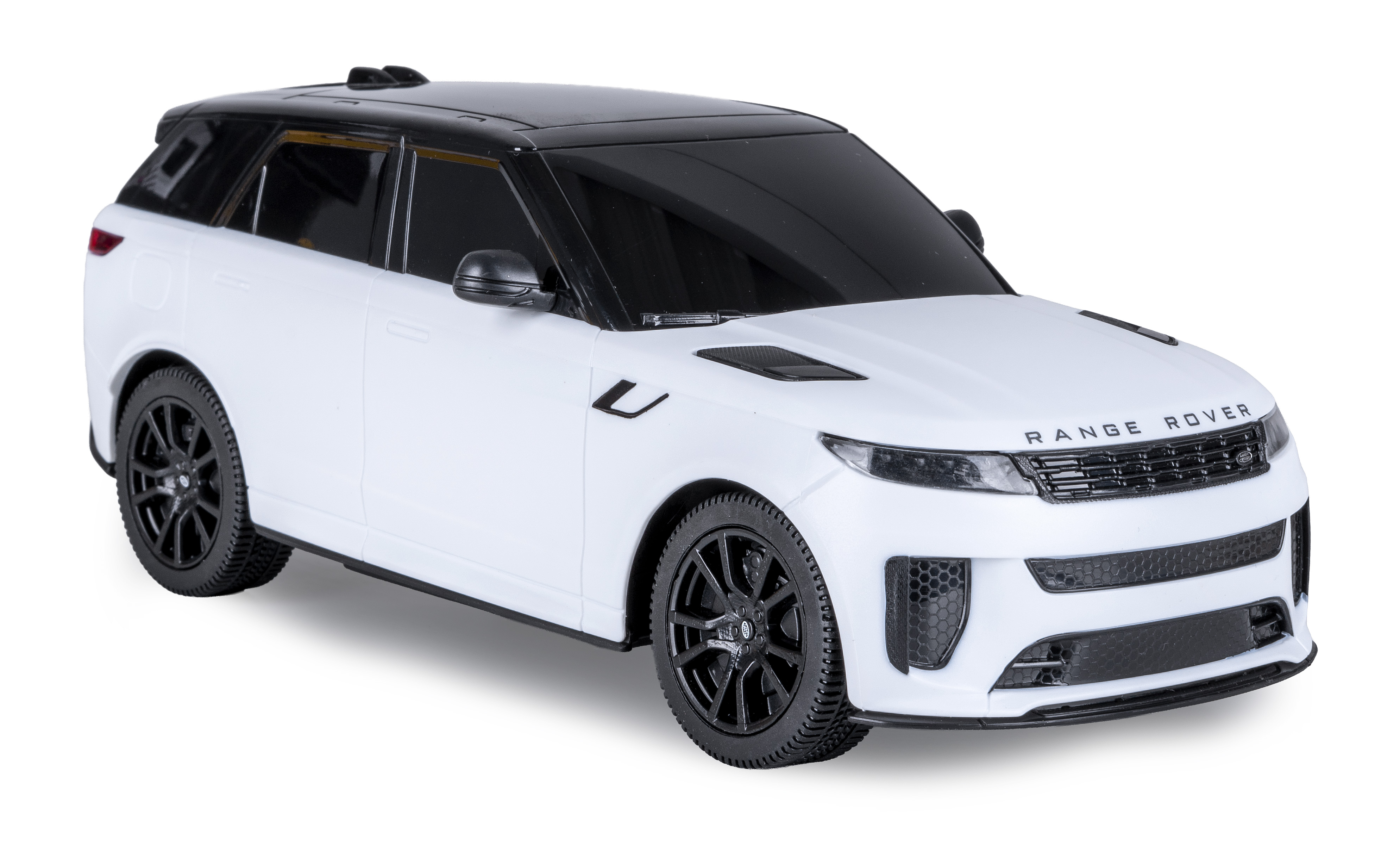 Ein weißer Range Rover mit schwarzem Dach und schwarzen Felgen.