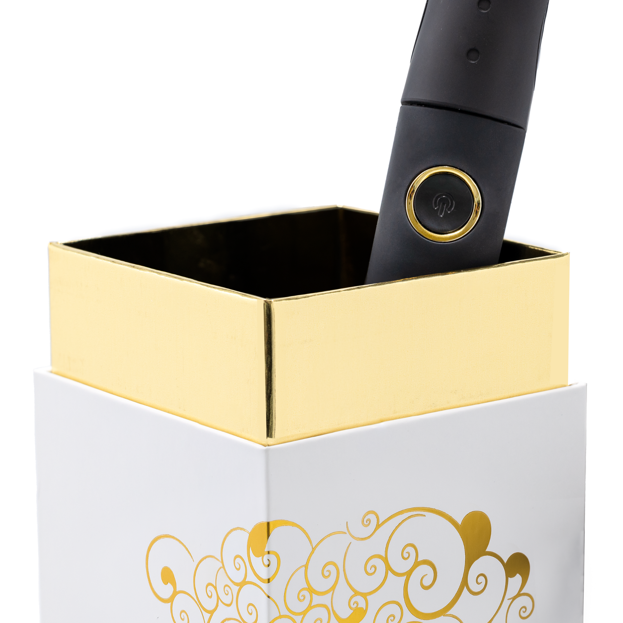 Ein schwarzer Stift mit goldenem Knopf steht in einer weißen und goldenen Box.