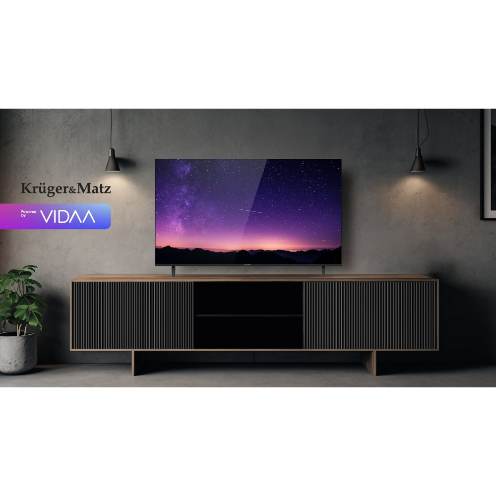 Nowoczesny telewizor z ekranem z gwieździstym niebem stoi na drewnianej szafce.