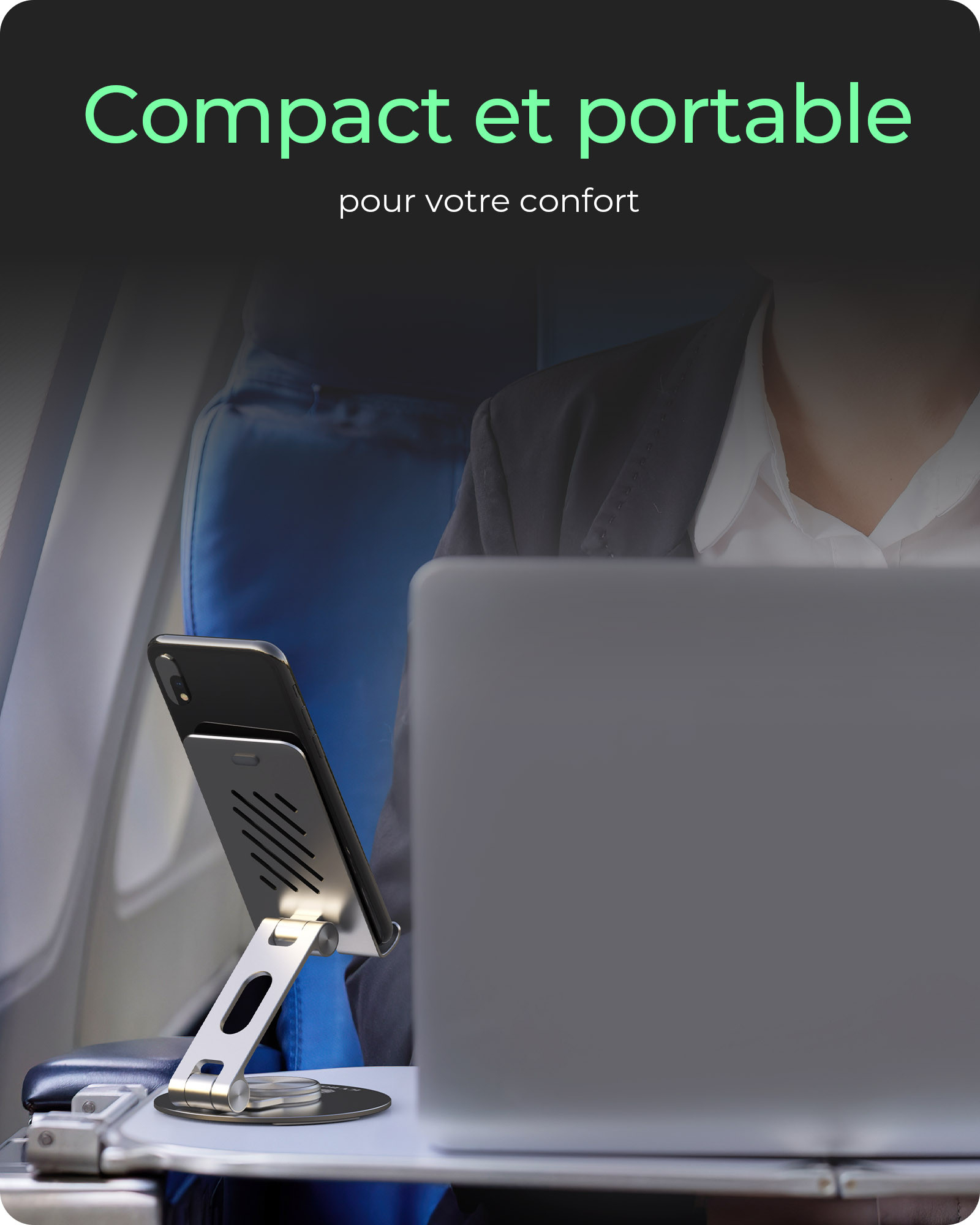 Un supporto per telefono e un laptop su un tavolino da aereo.