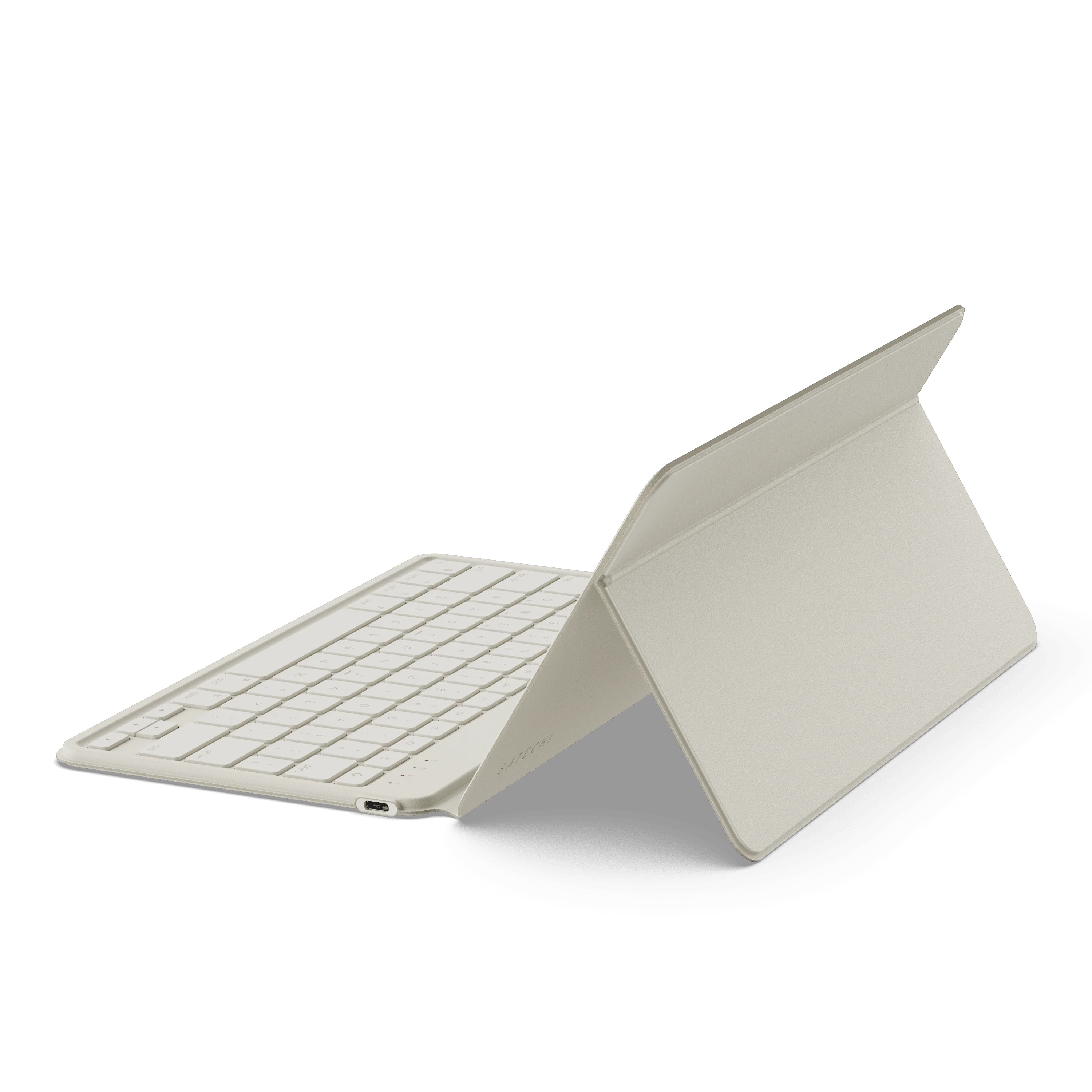 Jasno beżowy tablet z klawiaturą i podstawką.