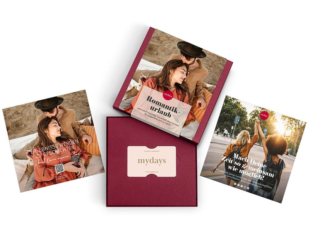 Drei MyDays-Gutscheine: Romantik, Erlebnisse, Zeit zu zweit. Ein roter Karton.