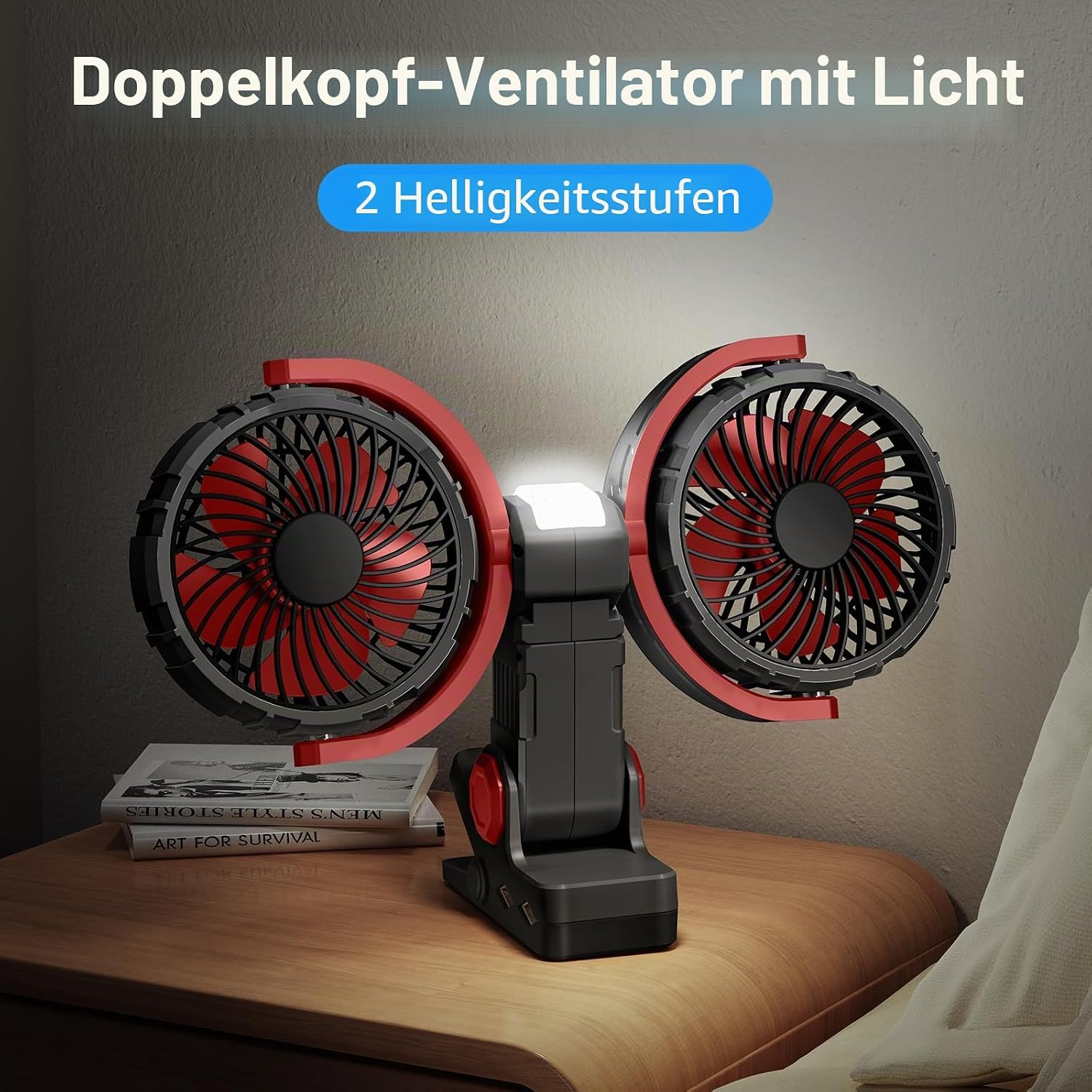 Ein schwarzer Doppelventilator mit roten Akzenten und LED-Licht steht auf einem Nachttisch.