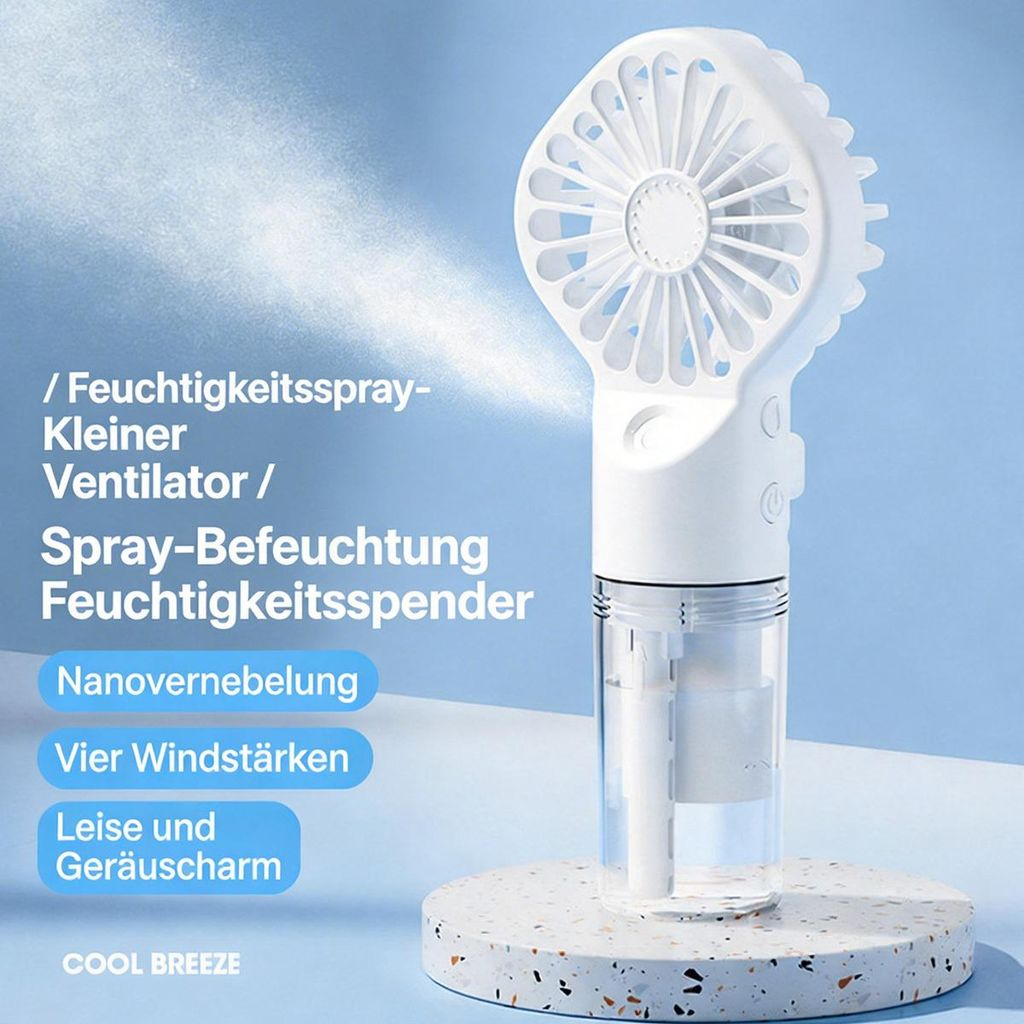 Ein weißer Handventilator mit Sprühfunktion auf einem dekorativen Untersetzer.