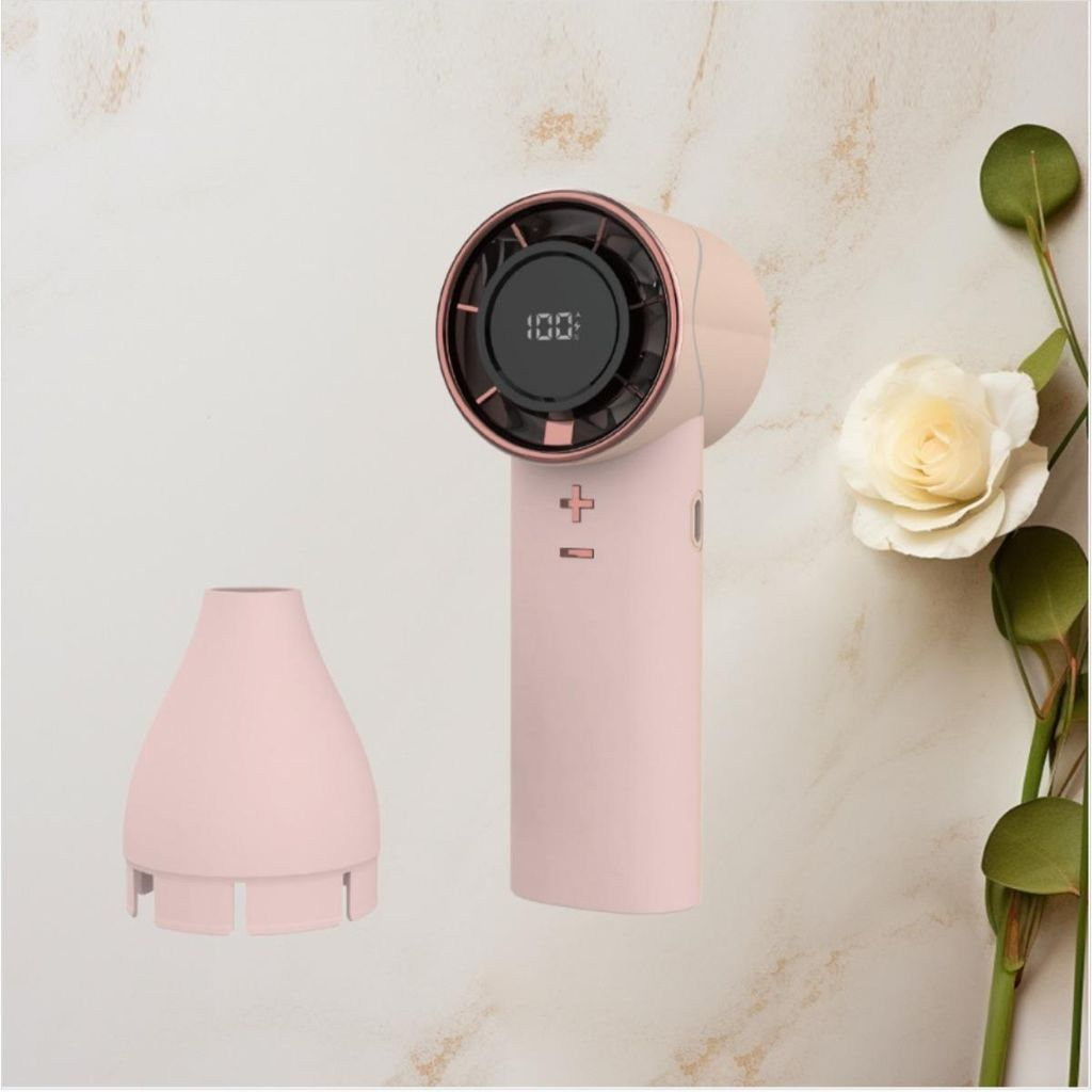 Ein rosafarbener Handventilator mit schwarzem Display und rosegoldenen Akzenten.