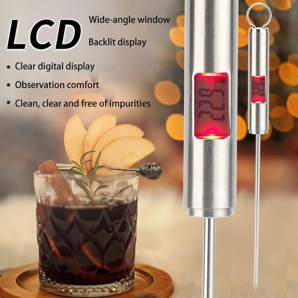 Digitales Thermometer mit rotem LCD-Display neben einem Glas Getränk.