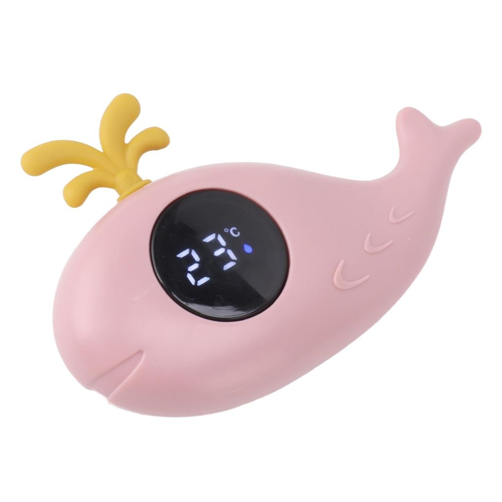 Ein rosafarbener Wal-Thermometer mit gelbem Kopfschmuck und digitaler Anzeige von 23°C.