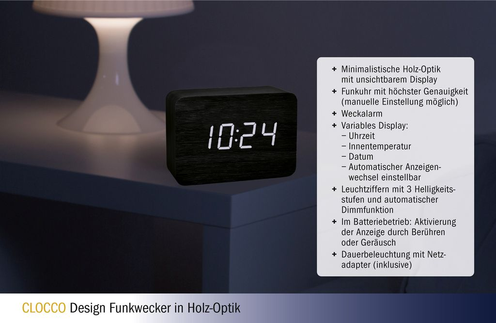 Schwarzer Digitalwecker mit Holzoptik zeigt 10:24 an, neben einer Lampe.