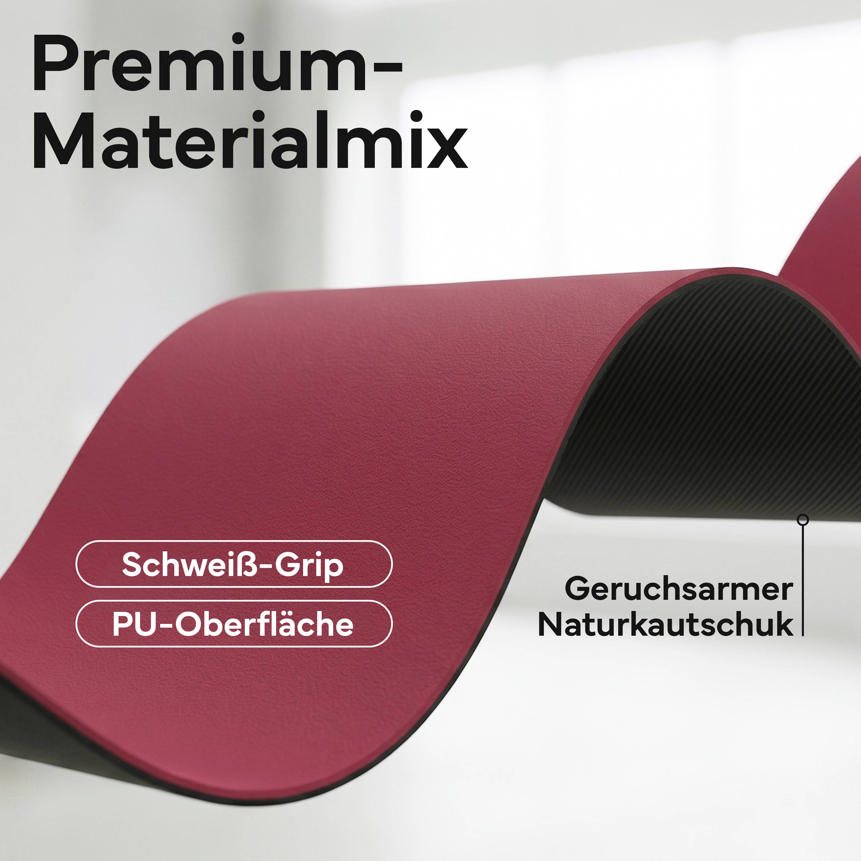 Bordeauxrote Matte mit schwarzer Unterseite. "Premium Materialmix" Schriftzug.