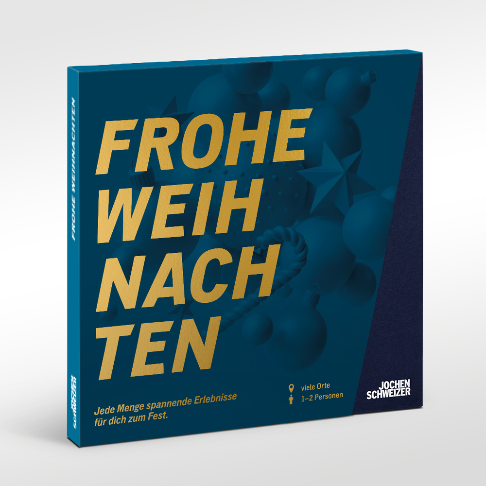 Dunkelblaue Geschenkbox mit goldenen Weihnachtsschriftzügen und Ornamenten.