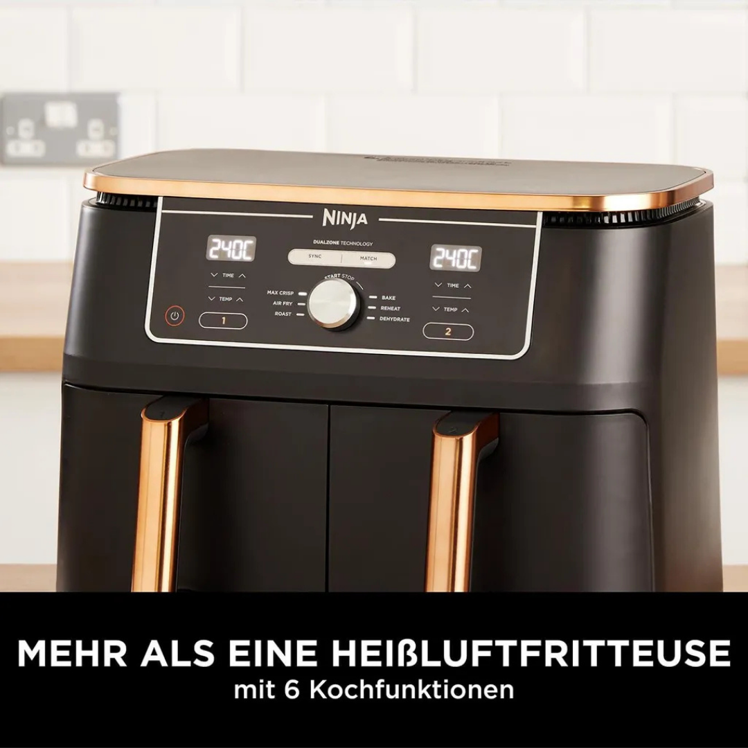 Friteuse à air Ninja noire avec poignées en cuivre et écrans numériques.