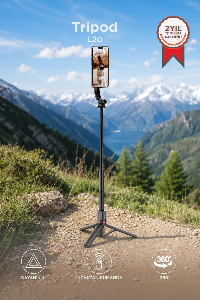 Dağlık manzarada telefon tutuculu siyah kamera tripod.