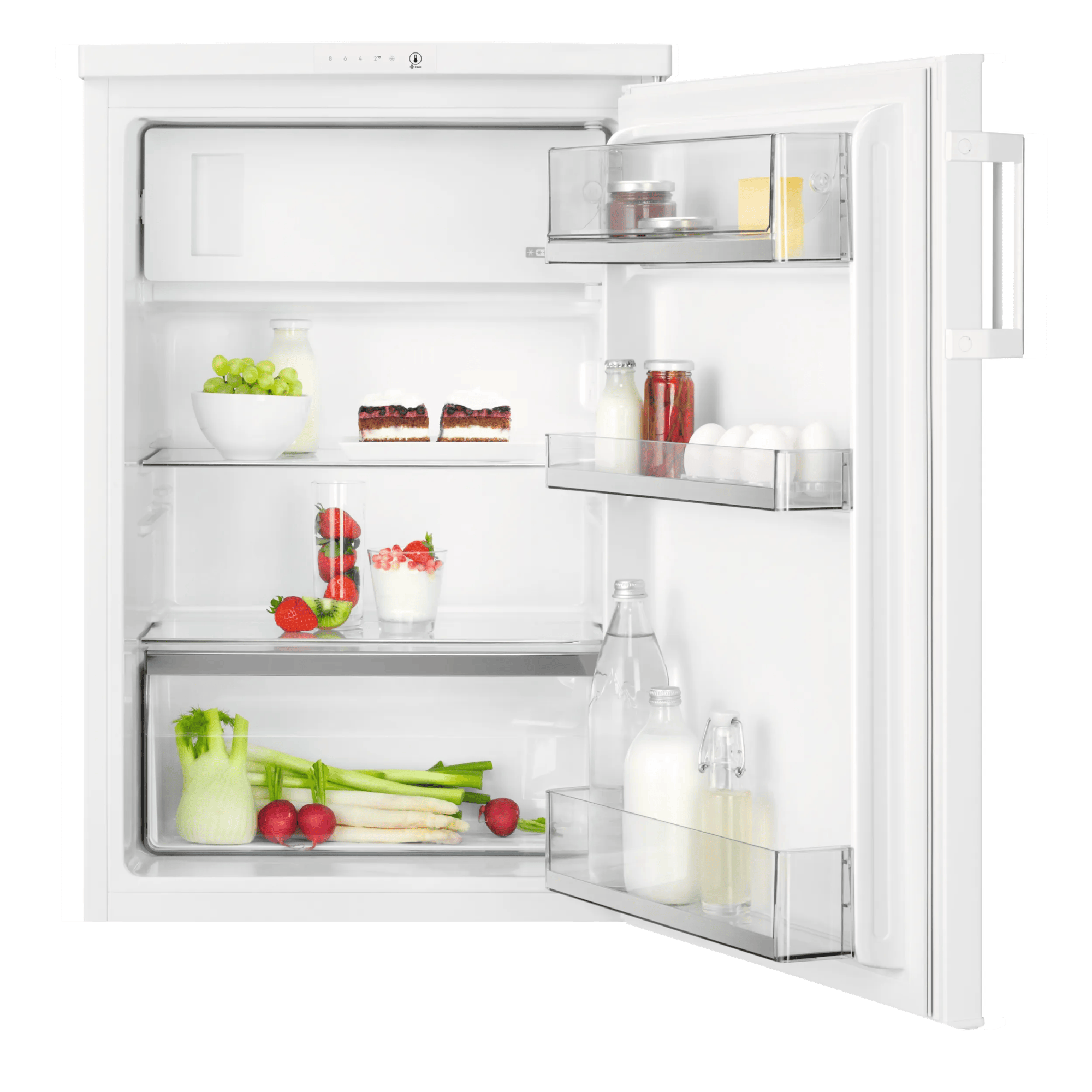 Un refrigerador blanco abierto con alimentos como frutas, pasteles, huevos y verduras.
